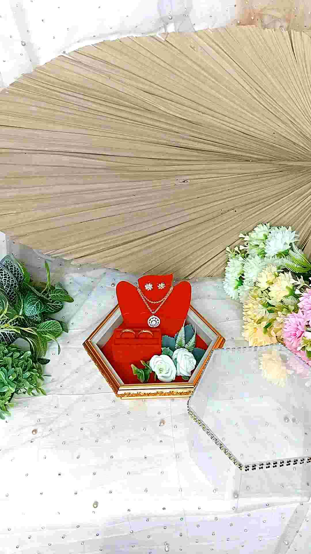 Nampan Frame Hexagonal Tempat Cincin untuk Seserahan Pernikahan - FCK HEXA\\n\\n Apa itu Nampan Frame Hexagonal?\\n\\nNampan Frame Hexagonal adalah aksesoris pernikahan yang dirancang dengan desain unik berbentuk heksagonal. Produk ini menjadi tempat cincin pernikahan yang elegan dan berkelas, sehingga cocok digunakan dalam seserahan pernikahan. \\n\\n Desain Hexagonal\\n\\nNampan Frame Hexagonal memiliki desain heksagonal yang menonjolkan keindahan dan keunikan. Desain ini membuat aksesoris pernikahan ini menjadi pusat perhatian dan memberikan kesan mewah pada acara pernikahan Anda.\\n\\n Keunggulan Nampan Frame Hexagonal\\n\\nBeberapa keunggulan Nampan Frame Hexagonal antara lain:\\n\\n- Desain unik dan elegan\\n- Terbuat dari bahan berkualitas tinggi\\n- Mudah dibersihkan dan disimpan\\n- Cocok untuk berbagai tema pernikahan\\n\\n Cara Menggunakan Nampan Frame Hexagonal dalam Seserahan Pernikahan\\n\\nBerikut adalah langkah-langkah penggunaan Nampan Frame Hexagonal dalam seserahan pernikahan:\\n\\n Persiapan Sebelum Penggunaan\\n\\nSebelum menggunakan Nampan Frame Hexagonal, pastikan Anda telah mempersiapkan cincin pernikahan dan meletakkannya di tempat yang aman. Selain itu, pastikan juga bahwa nampan sudah bersih dan siap digunakan.\\n\\n Tips Menyimpan dan Membersihkan Nampan Frame Hexagonal\\n\\nAgar Nampan Frame Hexagonal tetap awet dan terlihat cantik, berikut adalah beberapa tips penyimpanan dan pembersihan:\\n\\n- Simpan dalam kotak khusus atau wadah yang aman\\n- Bersihkan menggunakan kain lembut dan air bersih\\n- Hindari menyentuh bagian logam dengan tangan basah\\n\\n Mengapa Memilih Nampan Frame Hexagonal sebagai Aksesoris Pernikahan?\\n\\nBerikut adalah alasan mengapa Anda harus memilih Nampan Frame Hexagonal sebagai aksesoris pernikahan Anda:\\n\\n Kekuatan Brand FCK HEXA\\n\\nFCK HEXA adalah brand yang dikenal dengan produk-produk berkualitas tinggi dan desain unik. Dengan memilih Nampan Frame Hexagonal dari FCK HEXA, Anda dapat yakin bahwa produk tersebut akan memberikan nilai tambah pada acara pernikahan Anda.\\n\\n Desain Unik dan Berkelas\\n\\nNampan Frame Hexagonal memiliki desain heksagonal yang unik dan berkelas. Desain ini membuat aksesoris pernikahan ini menjadi pusat perhatian dan memberikan kesan mewah pada acara pernikahan Anda.\\n\\n Nampan Frame Hexagonal sebagai Tempat Cincin Pernikahan\\n\\nTempat cincin pernikahan merupakan salah satu aksesoris penting dalam seserahan pernikahan. Berikut adalah penjelasan lebih lanjut tentang fungsi Nampan Frame Hexagonal dalam menyimpan cincin:\\n\\n Pentingnya Tempat Cincin dalam Seserahan Pernikahan\\n\\nTempat cincin pernikahan memegang peranan penting dalam seserahan pernikahan karena menjadi simbol komitmen antara pengantin pria dan wanita. Selain itu, tempat cincin juga memberikan kesan mewah dan elegan pada acara pernikahan.\\n\\n Fungsi Nampan Frame Hexagonal dalam Menyimpan Cincin\\n\\nNampan Frame Hexagonal dirancang khusus untuk menyimpan cincin pernikahan dengan aman dan rapi. Desain heksagonal membuat aksesoris ini menjadi pusat perhatian dan memberikan kesan mewah pada acara pernikahan Anda.\\n\\n Kesimpulan\\n\\nNampan Frame Hexagonal adalah aksesoris pernikahan yang dirancang dengan desain unik berbentuk heksagonal. Produk ini menjadi tempat cincin pernikahan yang elegan dan berkelas, sehingga cocok digunakan dalam seserahan pernikahan. Dengan memilih Nampan Frame Hexagonal dari FCK HEXA, Anda dapat yakin bahwa produk tersebut akan memberikan nilai tambah pada acara pernikahan Anda.\\n\\n Rekomendasi Penggunaan Nampan Frame Hexagonal\\n\\nRekomendasi penggunaan Nampan Frame Hexagonal antara lain:\\n\\n- Cocok untuk berbagai tema pernikahan\\n- Mudah dibersihkan dan disimpan\\n- Desain unik dan elegan\n}